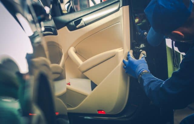 Car Mechanic Fixing Door